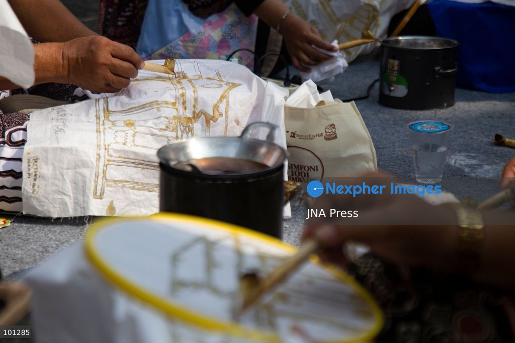 YOGYAKARTA, INDONESIA, OCTOBER 3, 2026: A total of 1,001 batik artists create traditional designs on fabric using canting tools along Malioboro Street in Yogyakarta during the "Symphony of 1001 Batik Artists" event. The mass batik-making activity was held as part of celebrations marking the 270th anniversary of Yogyakarta City and Indonesia's National Batik Day 2026. Photo by Topen Sapurta / JNA Press. (Photo by Topen Anggara Saputra/JNA Press via Nexpher Images)