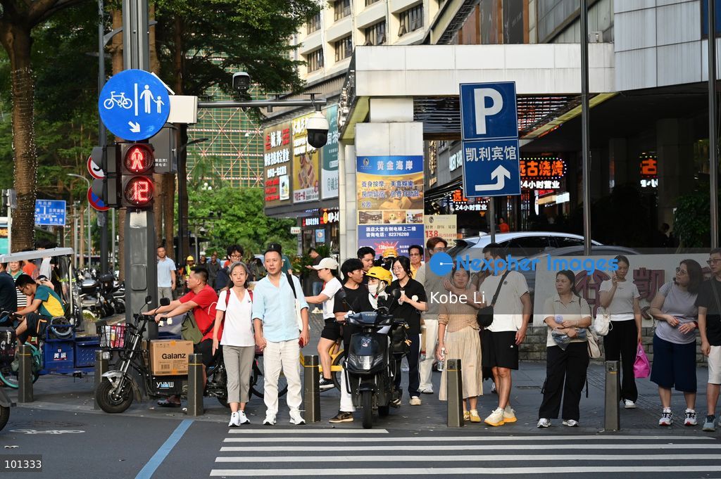 People waiting to cross the road on October 3, 2026 in Shenzhen, China. (Photo by Kobe Li/Nexpher Images)