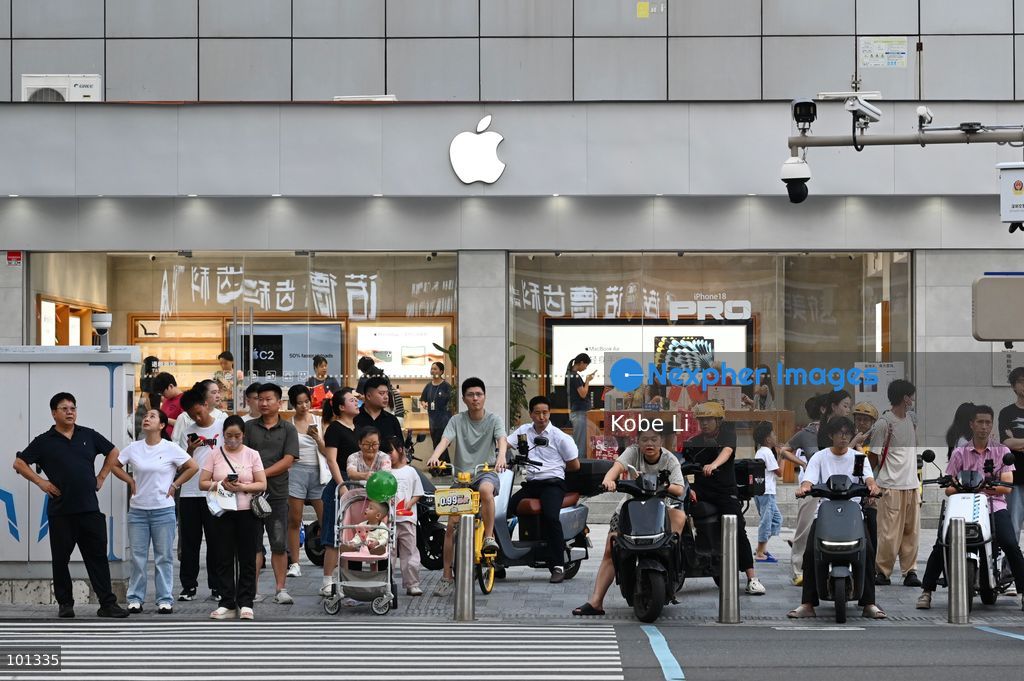 People staying in front of the Apple Store and waiting to cross the road on October 3, 2026 in Shenzhen, China. (Photo by Kobe Li/Nexpher Images)