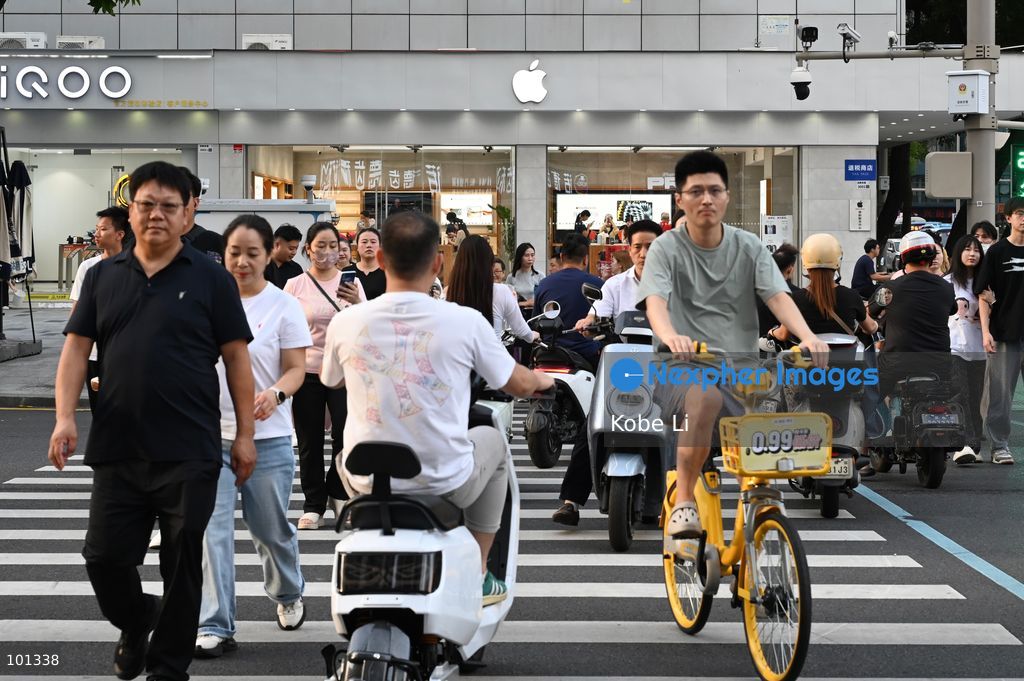 People crossing the road in front of the Apple Store on October 3, 2026 in Shenzhen, China. (Photo by Kobe Li/Nexpher Images)
