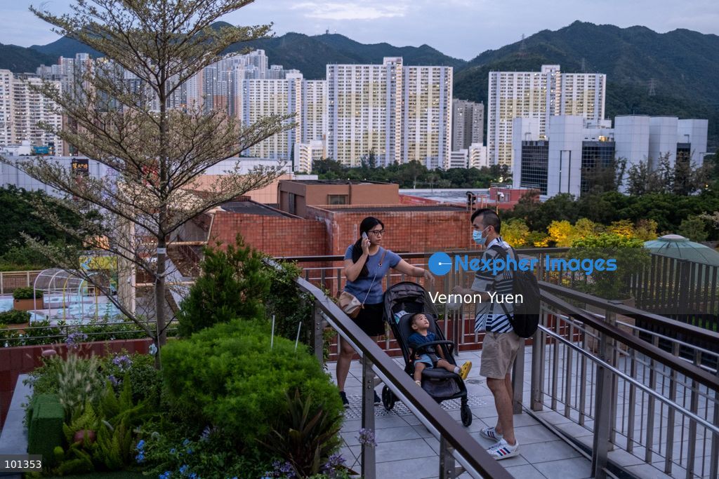 A woman pushing a baby stroller with a boy on it on October 3, 2026 in Hong Kong (Photo by Vernon Yuen/Nexpher Images)