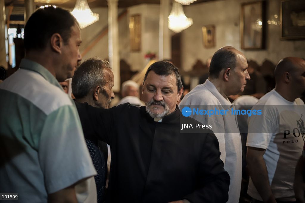 GAZA, PALESTINE – OCTOBER 3, 2026: Mourners attended the funeral of Christian mother Maysa Abu Dawood and her daughter Mary at Saint Porphyrius Church in Gaza City on Saturday, after they were killed early in the morning when an Israeli airstrike hit their residential apartment in the city. Mukhtars, community reconciliation figures and members of the Palestinian Civil Defense attended the funeral. The funeral was held at Saint Porphyrius Church, where mourners gathered to pay their respects to the mother and daughter. Photo by Mohammed M. Skaik / JNA Press. (Photo by Mohammed M Skaik/JNA Press via Nexpher Images)