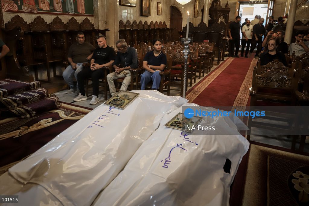 GAZA, PALESTINE – OCTOBER 3, 2026: Mourners attended the funeral of Christian mother Maysa Abu Dawood and her daughter Mary at Saint Porphyrius Church in Gaza City on Saturday, after they were killed early in the morning when an Israeli airstrike hit their residential apartment in the city. Mukhtars, community reconciliation figures and members of the Palestinian Civil Defense attended the funeral. The funeral was held at Saint Porphyrius Church, where mourners gathered to pay their respects to the mother and daughter. Photo by Mohammed M. Skaik / JNA Press. (Photo by Mohammed M Skaik/JNA Press via Nexpher Images)