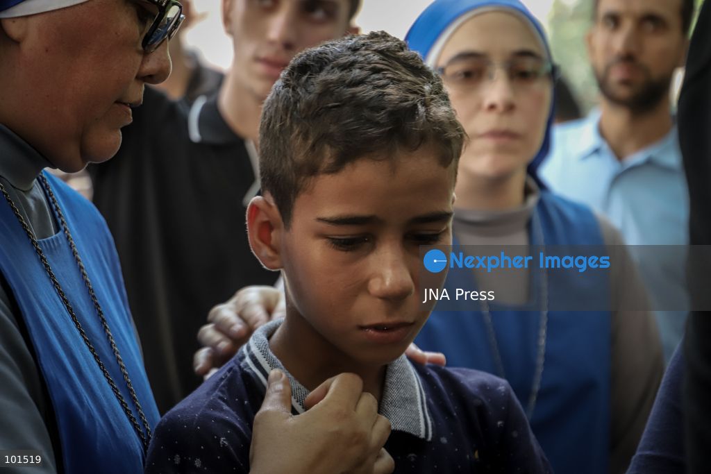 GAZA, PALESTINE – OCTOBER 3, 2026: Mourners attended the funeral of Christian mother Maysa Abu Dawood and her daughter Mary at Saint Porphyrius Church in Gaza City on Saturday, after they were killed early in the morning when an Israeli airstrike hit their residential apartment in the city. Mukhtars, community reconciliation figures and members of the Palestinian Civil Defense attended the funeral. The funeral was held at Saint Porphyrius Church, where mourners gathered to pay their respects to the mother and daughter. Photo by Mohammed M. Skaik / JNA Press. (Photo by Mohammed M Skaik/JNA Press via Nexpher Images)