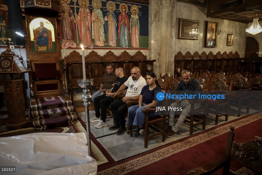 GAZA, PALESTINE – OCTOBER 3, 2026: Mourners attended the funeral of Christian mother Maysa Abu Dawood and her daughter Mary at Saint Porphyrius Church in Gaza City on Saturday, after they were killed early in the morning when an Israeli airstrike hit their residential apartment in the city. Mukhtars, community reconciliation figures and members of the Palestinian Civil Defense attended the funeral. The funeral was held at Saint Porphyrius Church, where mourners gathered to pay their respects to the mother and daughter. Photo by Mohammed M. Skaik / JNA Press. (Photo by Mohammed M Skaik/JNA Press via Nexpher Images)