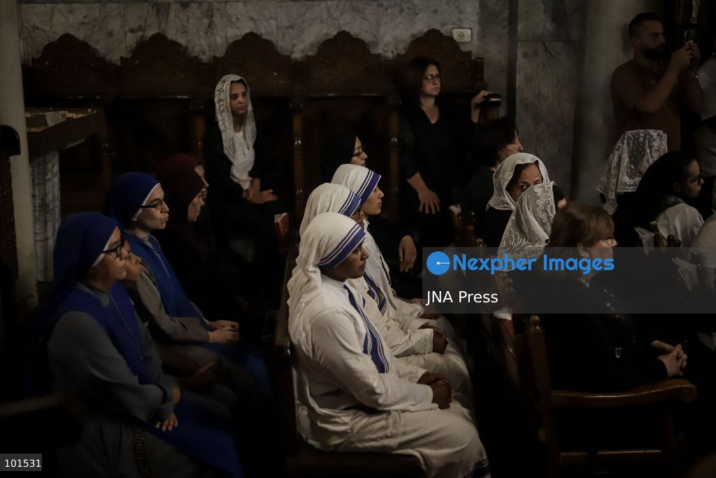 GAZA, PALESTINE – OCTOBER 3, 2026: Mourners attended the funeral of Christian mother Maysa Abu Dawood and her daughter Mary at Saint Porphyrius Church in Gaza City on Saturday, after they were killed early in the morning when an Israeli airstrike hit their residential apartment in the city. Mukhtars, community reconciliation figures and members of the Palestinian Civil Defense attended the funeral. The funeral was held at Saint Porphyrius Church, where mourners gathered to pay their respects to the mother and daughter. Photo by Mohammed M. Skaik / JNA Press. (Photo by Mohammed M Skaik/JNA Press via Nexpher Images)