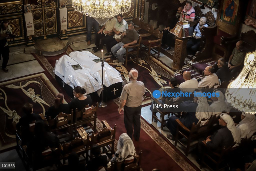 GAZA, PALESTINE – OCTOBER 3, 2026: Mourners attended the funeral of Christian mother Maysa Abu Dawood and her daughter Mary at Saint Porphyrius Church in Gaza City on Saturday, after they were killed early in the morning when an Israeli airstrike hit their residential apartment in the city. Mukhtars, community reconciliation figures and members of the Palestinian Civil Defense attended the funeral. The funeral was held at Saint Porphyrius Church, where mourners gathered to pay their respects to the mother and daughter. Photo by Mohammed M. Skaik / JNA Press. (Photo by Mohammed M Skaik/JNA Press via Nexpher Images)