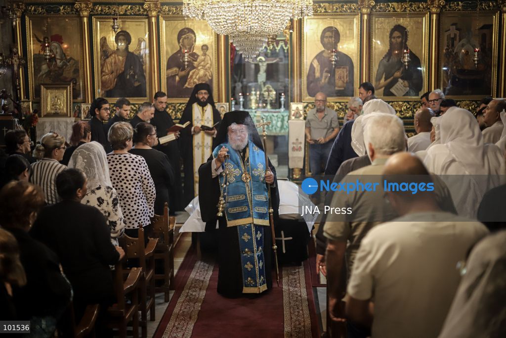 GAZA, PALESTINE – OCTOBER 3, 2026: Mourners attended the funeral of Christian mother Maysa Abu Dawood and her daughter Mary at Saint Porphyrius Church in Gaza City on Saturday, after they were killed early in the morning when an Israeli airstrike hit their residential apartment in the city. Mukhtars, community reconciliation figures and members of the Palestinian Civil Defense attended the funeral. The funeral was held at Saint Porphyrius Church, where mourners gathered to pay their respects to the mother and daughter. Photo by Mohammed M. Skaik / JNA Press. (Photo by Mohammed M Skaik/JNA Press via Nexpher Images)