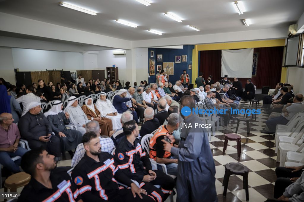 GAZA, PALESTINE – OCTOBER 3, 2026: Mourners attended the funeral of Christian mother Maysa Abu Dawood and her daughter Mary at Saint Porphyrius Church in Gaza City on Saturday, after they were killed early in the morning when an Israeli airstrike hit their residential apartment in the city. Mukhtars, community reconciliation figures and members of the Palestinian Civil Defense attended the funeral. The funeral was held at Saint Porphyrius Church, where mourners gathered to pay their respects to the mother and daughter. Photo by Mohammed M. Skaik / JNA Press. (Photo by Mohammed M Skaik/JNA Press via Nexpher Images)