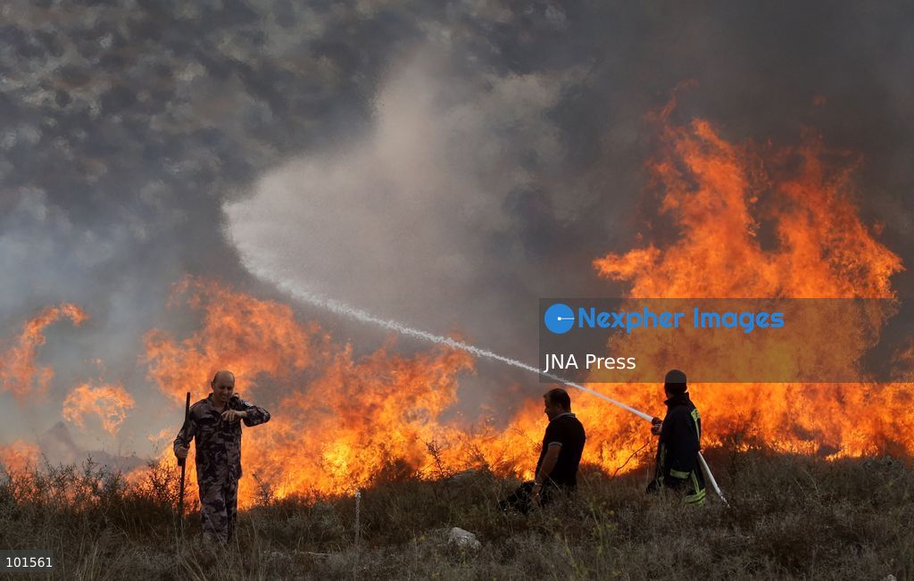 ASIRA AL-QIBLIYA, PALESTINE – OCTOBER 3, 2026: Palestinian farmers and civil defense personnel extinguished a fire in agricultural fields in Asira al-Qibliya village, south of Nablus, after Israeli army forces fired tear gas in the area. Israeli forces had prevented Palestinians from harvesting olives. Photo by Nedal Shtieh / JNA Press. (Photo by Nedal Shtieh/JNA Press via Nexpher Images)