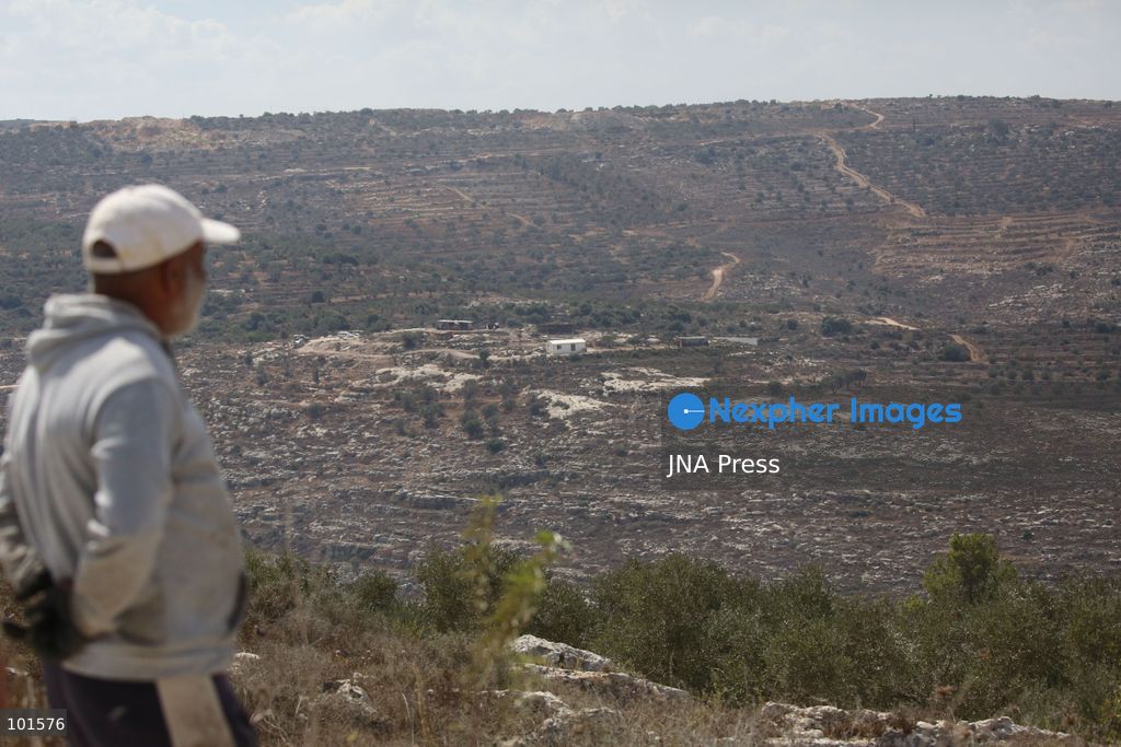 ASIRA AL-QIBLIYA, PALESTINE – OCTOBER 3, 2026: Palestinian farmers and civil defense personnel extinguished a fire in agricultural fields in Asira al-Qibliya village, south of Nablus, after Israeli army forces fired tear gas in the area. Israeli forces had prevented Palestinians from harvesting olives. Photo by Nedal Shtieh / JNA Press. (Photo by Nedal Shtieh/JNA Press via Nexpher Images)
