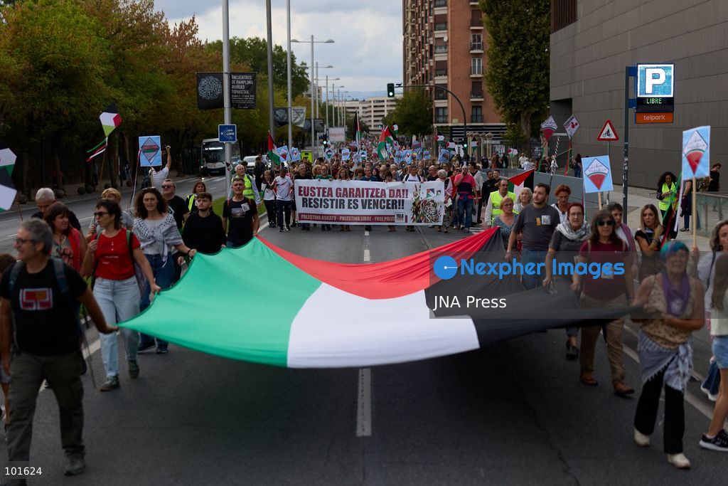 PAMPLONA, SPAIN, OCTOBER 3, 2026: Demonstrators take part in a pro-Palestinian march called by the citizens' platform Yala Nafarroa in Pamplona. Protesters carried Palestinian flags and banners expressing solidarity with Gaza, including a large banner reading "Stop Genocide," while participants also displayed messages calling for the protection of journalists. Photo by Unai Beroiz / JNA Press. (Photo by Unai Beroiz/JNA Press via Nexpher Images)