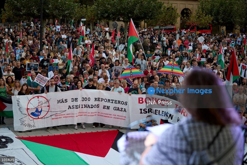PAMPLONA, SPAIN, OCTOBER 3, 2026: Demonstrators take part in a pro-Palestinian march called by the citizens' platform Yala Nafarroa in Pamplona. Protesters carried Palestinian flags and banners expressing solidarity with Gaza, including a large banner reading "Stop Genocide," while participants also displayed messages calling for the protection of journalists. Photo by Unai Beroiz / JNA Press. (Photo by Unai Beroiz/JNA Press via Nexpher Images)