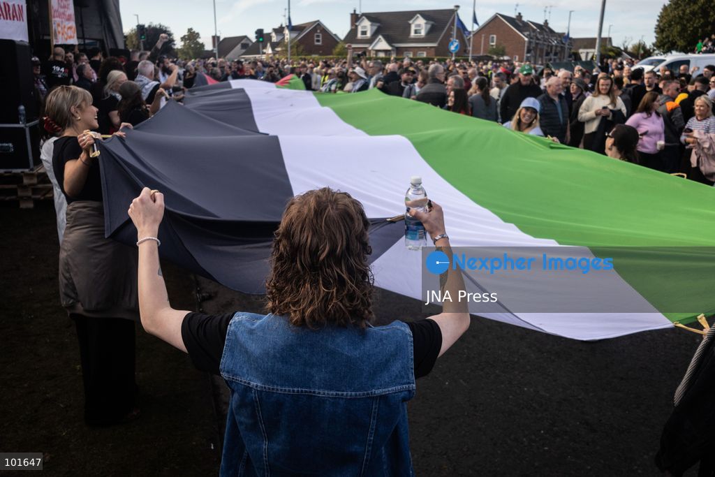 PORTADOWN, NORTHERN IRELAND, OCTOBER 3, 2026: Thousands of people gather near Garvaghy Road in Portadown during a solidarity rally on the seventh day of protests against an Orange Order parade through the area. Participants travelled from across Ireland to support the local community amid the continuing dispute over the proposed parade route. Organizers estimated that around 10,000 people attended the rally. Photo by Nadia Caimi / JNA Press. (Photo by Nadia Caimi/JNA Press via Nexpher Images)