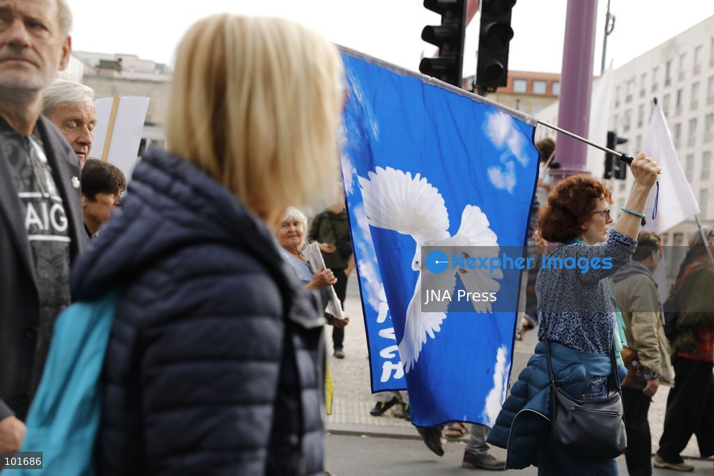 BERLIN, GERMANY, OCTOBER 3, 2026: Thousands of people march through central Berlin during a peace demonstration against military rearmament, compulsory military service and war on German Unity Day. Protesters gathered near the Brandenburg Gate before marching through the city, with trade unions, peace movements, political groups and a pro-Palestinian bloc taking part. Berlin police estimated attendance at around 5,800, while organizers put the number at more than 20,000. Police detained at least two protesters during the demonstration. Photo by Alessia Cocca / JNA Press (Photo by Alessia Cocca/JNA Press via Nexpher Images)