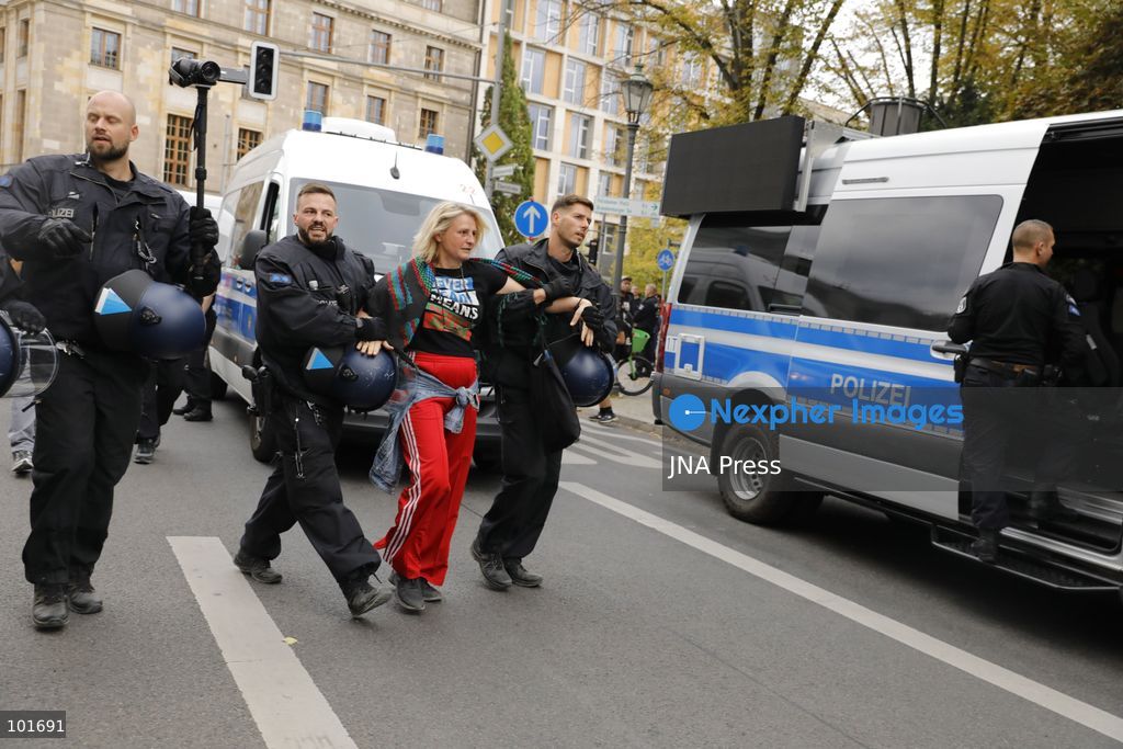 BERLIN, GERMANY, OCTOBER 3, 2026: Thousands of people march through central Berlin during a peace demonstration against military rearmament, compulsory military service and war on German Unity Day. Protesters gathered near the Brandenburg Gate before marching through the city, with trade unions, peace movements, political groups and a pro-Palestinian bloc taking part. Berlin police estimated attendance at around 5,800, while organizers put the number at more than 20,000. Police detained at least two protesters during the demonstration. Photo by Alessia Cocca / JNA Press (Photo by Alessia Cocca/JNA Press via Nexpher Images)