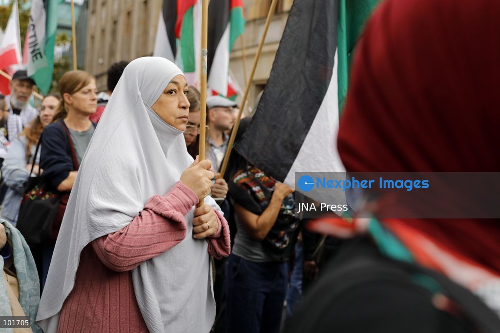 BERLIN, GERMANY, OCTOBER 3, 2026: Thousands of people march through central Berlin during a peace demonstration against military rearmament, compulsory military service and war on German Unity Day. Protesters gathered near the Brandenburg Gate before marching through the city, with trade unions, peace movements, political groups and a pro-Palestinian bloc taking part. Berlin police estimated attendance at around 5,800, while organizers put the number at more than 20,000. Police detained at least two protesters during the demonstration. Photo by Alessia Cocca / JNA Press (Photo by Alessia Cocca/JNA Press via Nexpher Images)