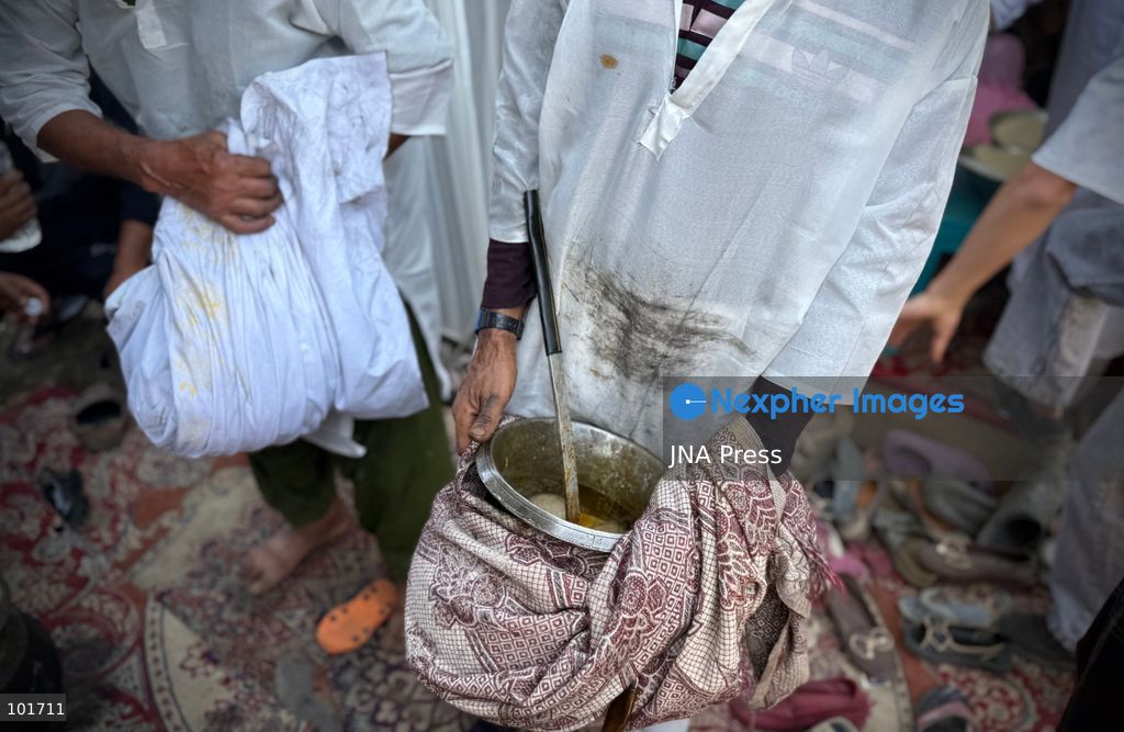 KULGAM, JAMMU AND KASHMIR, INDIA, OCTOBER 4, 2026: Traditional cooks prepare Wazwan, Kashmir's multi-course meat feast, in Kulgam. The elaborate meal remains an important part of Kashmiri weddings and other celebrations, with dishes traditionally prepared by specialist cooks known as wazas. The centuries-old culinary tradition continues to be practiced across Kashmir despite changing lifestyles and modern wedding customs. Photo by Hilal Zargar / JNA Press. (Photo by Hilal Zargar/JNA Press via Nexpher Images)