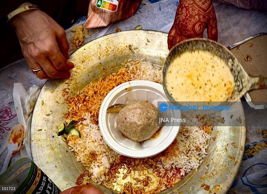 KULGAM, JAMMU AND KASHMIR, INDIA, OCTOBER 4, 2026: Traditional cooks prepare Wazwan, Kashmir's multi-course meat feast, in Kulgam. The elaborate meal remains an important part of Kashmiri weddings and other celebrations, with dishes traditionally prepared by specialist cooks known as wazas. The centuries-old culinary tradition continues to be practiced across Kashmir despite changing lifestyles and modern wedding customs. Photo by Hilal Zargar / JNA Press. (Photo by Hilal Zargar/JNA Press via Nexpher Images)