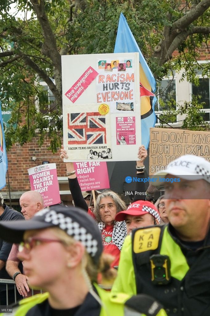 DOVER, UNITED KINGDOM, OCTOBER 3, 2026: Anti-immigration protesters and anti-racism counter-protesters gather during rival demonstrations in Dover, Kent. Anti-immigration demonstrators carrying Union flags and St George's flags displayed banners calling for deportations and an end to small-boat crossings, while counter-protesters gathered nearby. Police maintained a significant presence between the groups and monitored the demonstrations. Photo by Marc Lewis / JNA Press. (Photo by Marc Lewis/JNA Press via Nexpher Images)