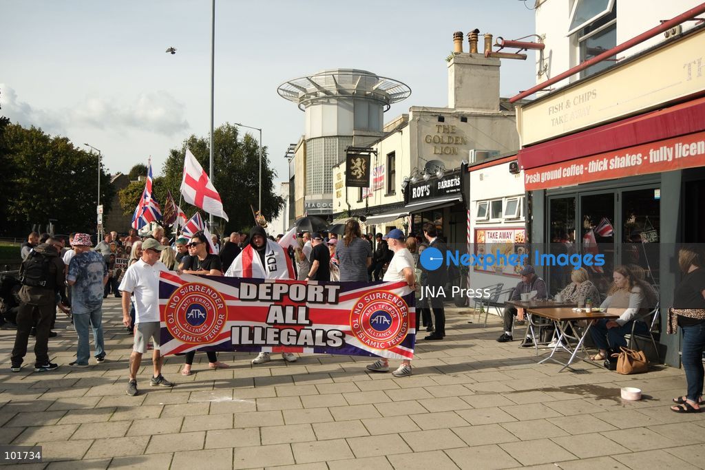 DOVER, UNITED KINGDOM, OCTOBER 3, 2026: Anti-immigration protesters and anti-racism counter-protesters gather during rival demonstrations in Dover, Kent. Anti-immigration demonstrators carrying Union flags and St George's flags displayed banners calling for deportations and an end to small-boat crossings, while counter-protesters gathered nearby. Police maintained a significant presence between the groups and monitored the demonstrations. Photo by Marc Lewis / JNA Press. (Photo by Marc Lewis/JNA Press via Nexpher Images)