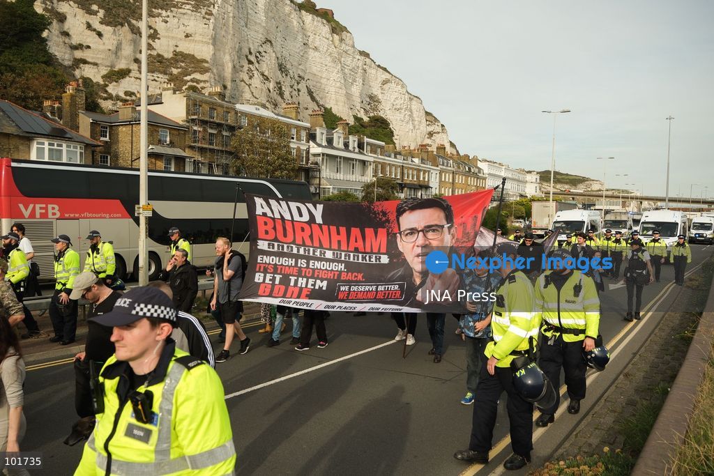 DOVER, UNITED KINGDOM, OCTOBER 3, 2026: Anti-immigration protesters and anti-racism counter-protesters gather during rival demonstrations in Dover, Kent. Anti-immigration demonstrators carrying Union flags and St George's flags displayed banners calling for deportations and an end to small-boat crossings, while counter-protesters gathered nearby. Police maintained a significant presence between the groups and monitored the demonstrations. Photo by Marc Lewis / JNA Press. (Photo by Marc Lewis/JNA Press via Nexpher Images)