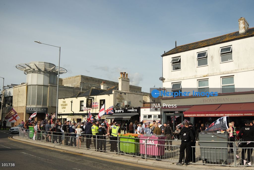 DOVER, UNITED KINGDOM, OCTOBER 3, 2026: Anti-immigration protesters and anti-racism counter-protesters gather during rival demonstrations in Dover, Kent. Anti-immigration demonstrators carrying Union flags and St George's flags displayed banners calling for deportations and an end to small-boat crossings, while counter-protesters gathered nearby. Police maintained a significant presence between the groups and monitored the demonstrations. Photo by Marc Lewis / JNA Press. (Photo by Marc Lewis/JNA Press via Nexpher Images)