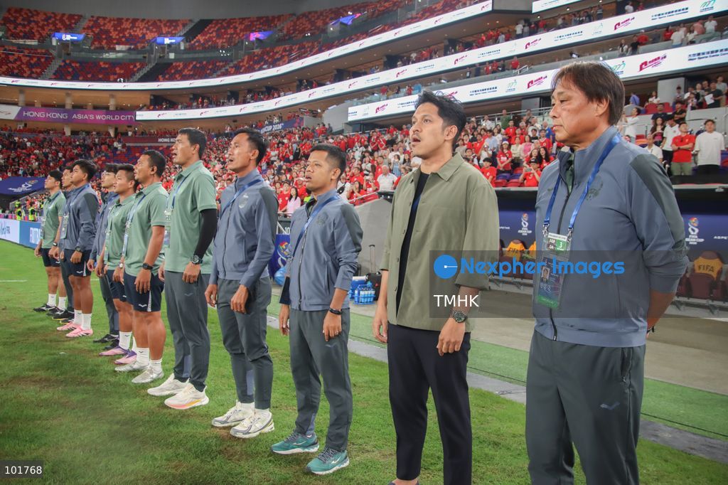 Members of the Cambodia coaching staff sing the national anthem ahead of the FIFA ASEAN Challenge Cup final against Hong Kong, China at Kai Tak Stadium in Hong Kong on October 3, 2026. (Photo by Gordon Choi/TMHK via Nexpher Images)