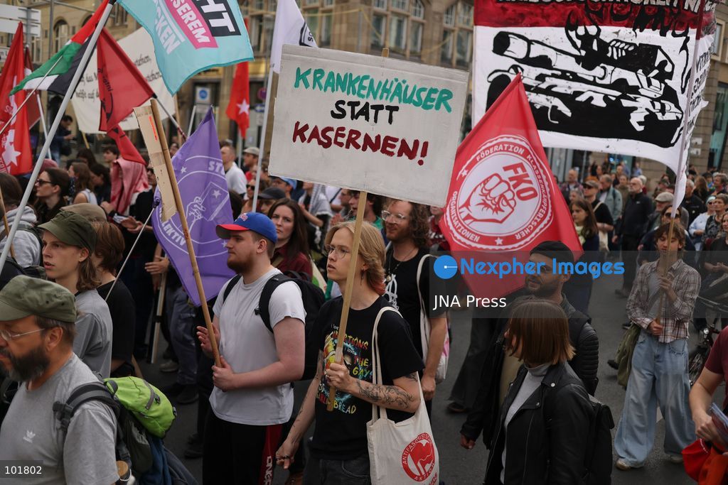 BERLIN, GERMANY, OCTOBER 3, 2026: Thousands of demonstrators march through central Berlin during a protest against Germany's military buildup, increased defense spending and the possible reintroduction of compulsory military service. Protesters called for greater investment in healthcare, housing, education and other social services instead of military spending, while participants also demonstrated against German arms deliveries and support for Israel amid the war in Gaza. The march began at the Brandenburg Gate and continued through central Berlin before returning to the area. Photo by Zaira Bilagini / JNA Press. (Photo by Zaira Biagini/JNA Press via Nexpher Images)