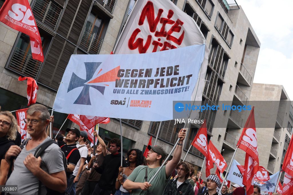 BERLIN, GERMANY, OCTOBER 3, 2026: Thousands of demonstrators march through central Berlin during a protest against Germany's military buildup, increased defense spending and the possible reintroduction of compulsory military service. Protesters called for greater investment in healthcare, housing, education and other social services instead of military spending, while participants also demonstrated against German arms deliveries and support for Israel amid the war in Gaza. The march began at the Brandenburg Gate and continued through central Berlin before returning to the area. Photo by Zaira Bilagini / JNA Press. (Photo by Zaira Biagini/JNA Press via Nexpher Images)