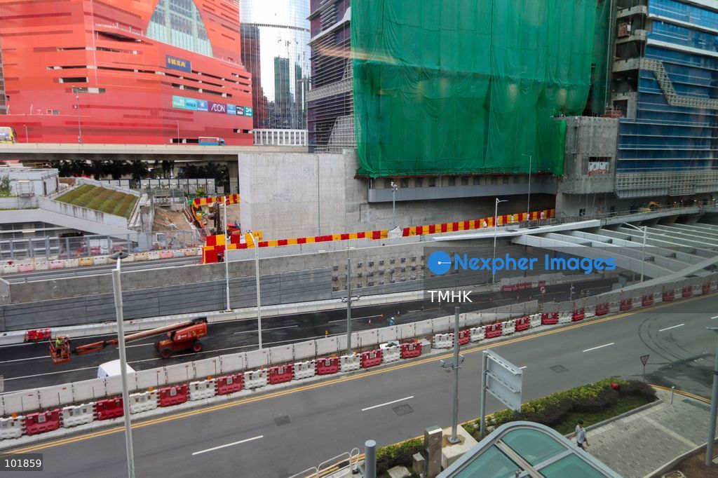An exterior general view shows the facade and surroundings of Kai Tak Hospital in East Kowloon on October 4, 2026 in Hong Kong, with the transport corridor of the Central Kowloon Bypass and the commercial skyline around MegaBox mall visible in the background. (Photo by Gordon Choi/TMHK via Nexpher Images)