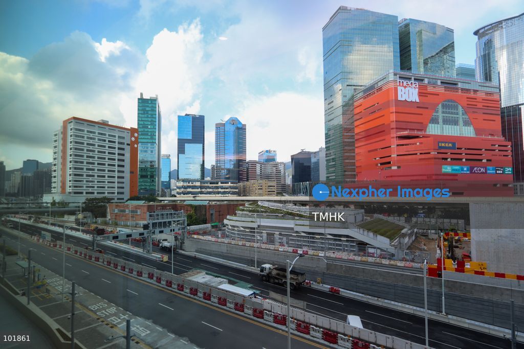 An exterior general view shows the facade and surroundings of Kai Tak Hospital in East Kowloon on October 4, 2026 in Hong Kong, with the transport corridor of the Central Kowloon Bypass and the commercial skyline around MegaBox mall visible in the background. (Photo by Gordon Choi/TMHK via Nexpher Images)