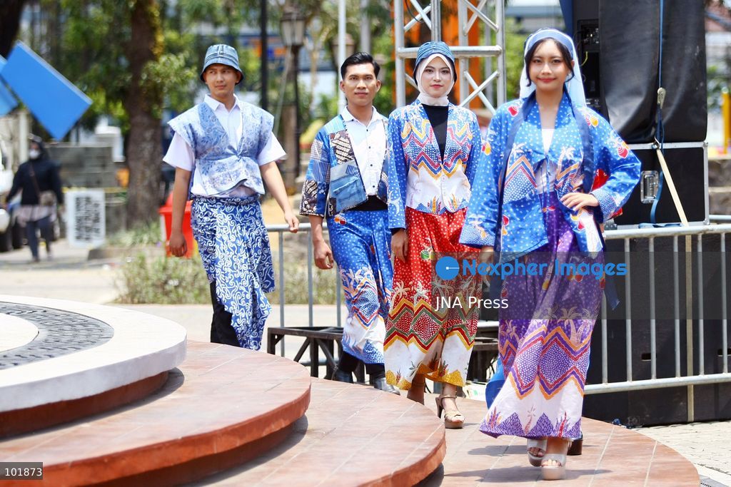 MALANG, EAST JAVA, INDONESIA, OCTOBER 4, 2026: Visitors and artisans take part in National Batik Day celebrations in Malang, featuring batik-making workshops, textile exhibitions and fashion shows showcasing traditional Indonesian designs. Batik is produced using a wax-resist dyeing technique, with patterns traditionally applied using a canting tool. Indonesian batik was inscribed by UNESCO on its Representative List of the Intangible Cultural Heritage of Humanity in 2009. Photo by Hayu Yudha Prabowo / JNA Press. (Photo by Hayu Yudha Prabowo/JNA Press via Nexpher Images)