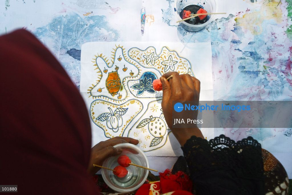 MALANG, EAST JAVA, INDONESIA, OCTOBER 4, 2026: Visitors and artisans take part in National Batik Day celebrations in Malang, featuring batik-making workshops, textile exhibitions and fashion shows showcasing traditional Indonesian designs. Batik is produced using a wax-resist dyeing technique, with patterns traditionally applied using a canting tool. Indonesian batik was inscribed by UNESCO on its Representative List of the Intangible Cultural Heritage of Humanity in 2009. Photo by Hayu Yudha Prabowo / JNA Press. (Photo by Hayu Yudha Prabowo/JNA Press via Nexpher Images)