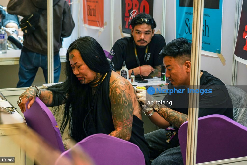 LALITPUR, NEPAL, October 4, 2026: A tattoo artist tattoos a customer during the Himalayan Tattoo Summit 0.3 at Majestic Grand in Lalitpur, Nepal. The summit brings together more than 200 tattoo artists, over 100 studios, and industry professionals from around the world to celebrate tattoo culture, heritage, creativity, and lifestyle. (Photo by ap tolang/Nexpher Images)