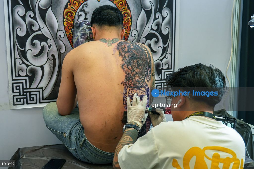 LALITPUR, NEPAL, October 4, 2026: A tattoo artist tattoos a customer during the Himalayan Tattoo Summit 0.3 at Majestic Grand in Lalitpur, Nepal. The summit brings together more than 200 tattoo artists, over 100 studios, and industry professionals from around the world to celebrate tattoo culture, heritage, creativity, and lifestyle. (Photo by ap tolang/Nexpher Images)