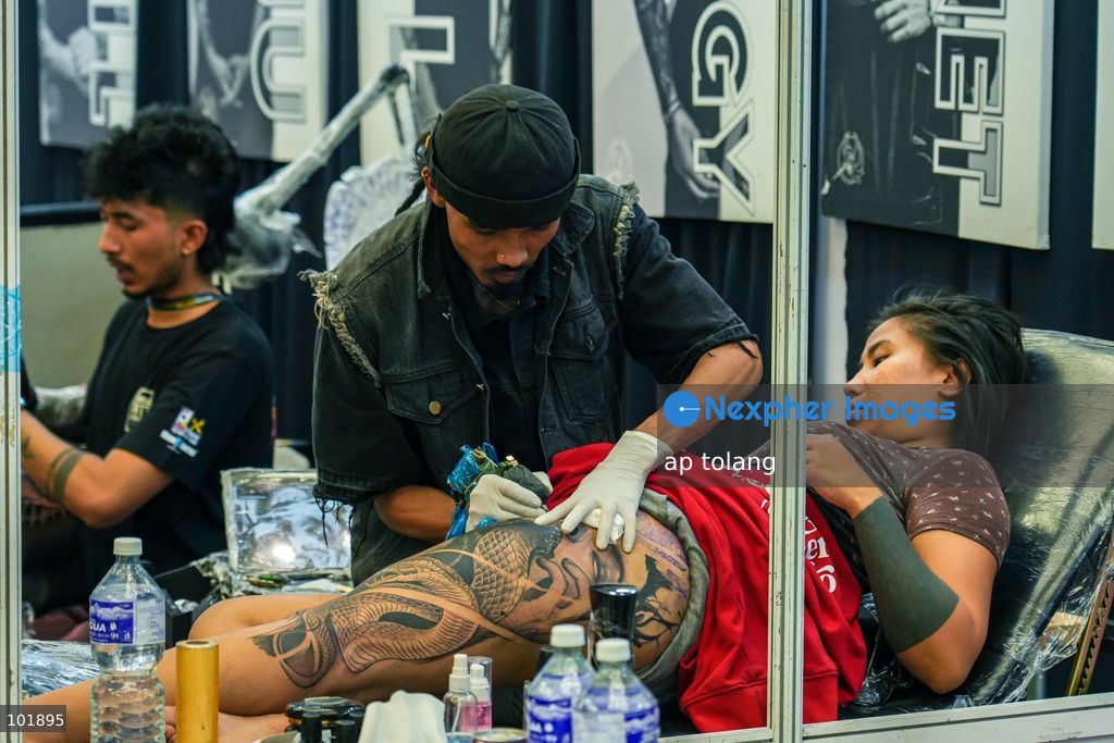 LALITPUR, NEPAL, October 4, 2026: A tattoo artist tattoos a customer during the Himalayan Tattoo Summit 0.3 at Majestic Grand in Lalitpur, Nepal. The summit brings together more than 200 tattoo artists, over 100 studios, and industry professionals from around the world to celebrate tattoo culture, heritage, creativity, and lifestyle. (Photo by ap tolang/Nexpher Images)