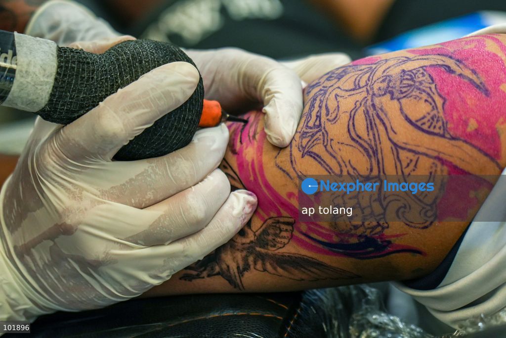 LALITPUR, NEPAL, October 4, 2026: A tattoo artist tattoos a customer during the Himalayan Tattoo Summit 0.3 at Majestic Grand in Lalitpur, Nepal. The summit brings together more than 200 tattoo artists, over 100 studios, and industry professionals from around the world to celebrate tattoo culture, heritage, creativity, and lifestyle. (Photo by ap tolang/Nexpher Images)