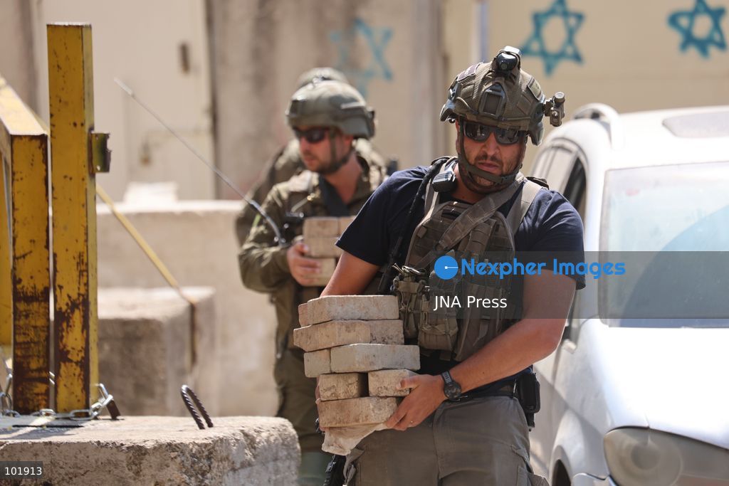 HEBRON, OCCUPIED WEST BANK, OCTOBER 4, 2026: Newly installed Israeli military gates are seen near entrances to Hebron's Old City as Israeli forces impose additional movement restrictions in the area. One of the new iron gates was installed in the Al-Zahid area, a key route connecting neighborhoods of the Old City and providing access toward the Ibrahimi Mosque. Local shop owner Badr al-Tamimi said the restrictions were affecting access to more than 1,000 commercial shops and over 500 homes in the area. Photo by Mosab Shawer / JNA Press. (Photo by Mosab shawer/JNA Press via Nexpher Images)