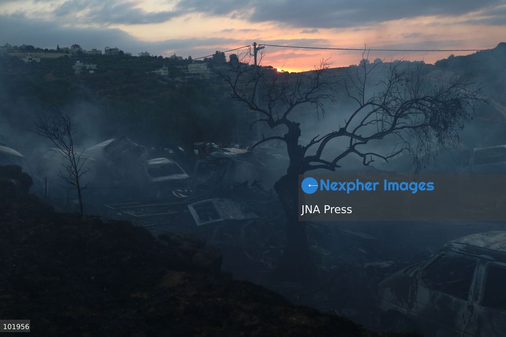 SILWAD, WEST BANK, PALESTINE – OCTOBER 4, 2026: Israeli settlers set fire to olive trees and a car scrap yard between the villages of Ein Yabrud and Silwad, according to the information provided. The owner of the repair shop said more than 50 cars were destroyed in the fire. The incident occurred amid ongoing attacks targeting Palestinian property and agricultural land in the area. Fires affecting olive trees and other Palestinian property have also been reported in areas around Silwad. Photo by Salman Mohsen Alkhatib / JNA Press (Photo by Salman Mohsen Alkhatib/JNA Press via Nexpher Images)