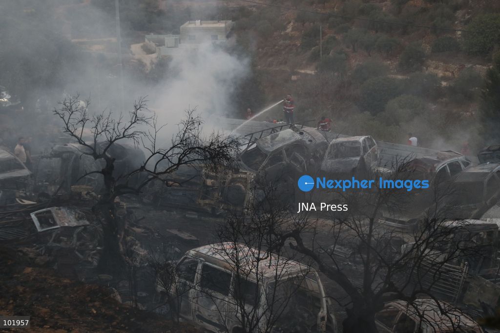 SILWAD, WEST BANK, PALESTINE – OCTOBER 4, 2026: Israeli settlers set fire to olive trees and a car scrap yard between the villages of Ein Yabrud and Silwad, according to the information provided. The owner of the repair shop said more than 50 cars were destroyed in the fire. The incident occurred amid ongoing attacks targeting Palestinian property and agricultural land in the area. Fires affecting olive trees and other Palestinian property have also been reported in areas around Silwad. Photo by Salman Mohsen Alkhatib / JNA Press (Photo by Salman Mohsen Alkhatib/JNA Press via Nexpher Images)