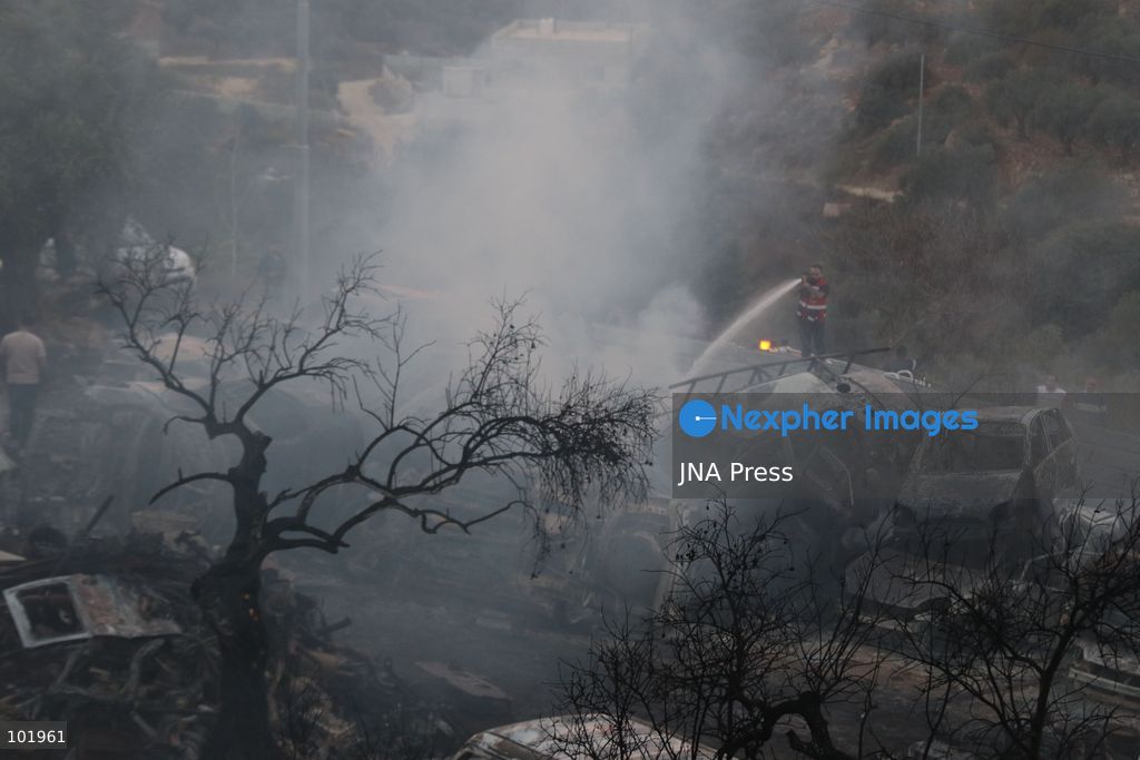 SILWAD, WEST BANK, PALESTINE – OCTOBER 4, 2026: Israeli settlers set fire to olive trees and a car scrap yard between the villages of Ein Yabrud and Silwad, according to the information provided. The owner of the repair shop said more than 50 cars were destroyed in the fire. The incident occurred amid ongoing attacks targeting Palestinian property and agricultural land in the area. Fires affecting olive trees and other Palestinian property have also been reported in areas around Silwad. Photo by Salman Mohsen Alkhatib / JNA Press (Photo by Salman Mohsen Alkhatib/JNA Press via Nexpher Images)