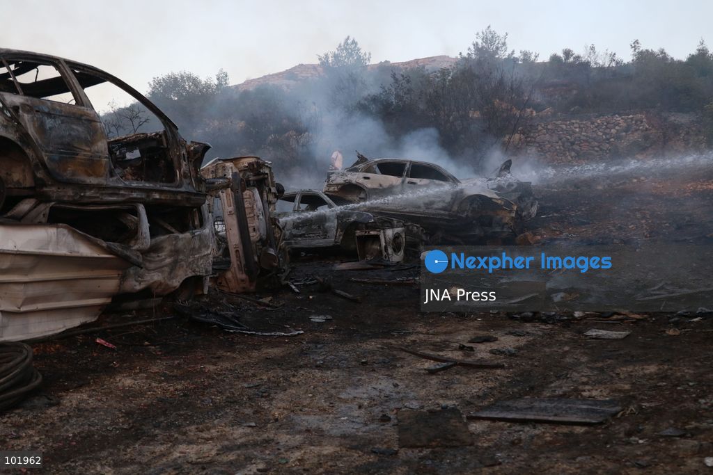 SILWAD, WEST BANK, PALESTINE – OCTOBER 4, 2026: Israeli settlers set fire to olive trees and a car scrap yard between the villages of Ein Yabrud and Silwad, according to the information provided. The owner of the repair shop said more than 50 cars were destroyed in the fire. The incident occurred amid ongoing attacks targeting Palestinian property and agricultural land in the area. Fires affecting olive trees and other Palestinian property have also been reported in areas around Silwad. Photo by Salman Mohsen Alkhatib / JNA Press (Photo by Salman Mohsen Alkhatib/JNA Press via Nexpher Images)