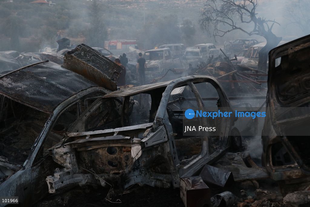 SILWAD, WEST BANK, PALESTINE – OCTOBER 4, 2026: Israeli settlers set fire to olive trees and a car scrap yard between the villages of Ein Yabrud and Silwad, according to the information provided. The owner of the repair shop said more than 50 cars were destroyed in the fire. The incident occurred amid ongoing attacks targeting Palestinian property and agricultural land in the area. Fires affecting olive trees and other Palestinian property have also been reported in areas around Silwad. Photo by Salman Mohsen Alkhatib / JNA Press (Photo by Salman Mohsen Alkhatib/JNA Press via Nexpher Images)