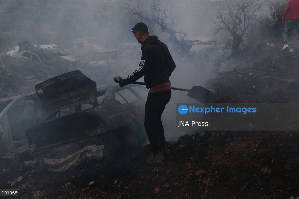 SILWAD, WEST BANK, PALESTINE – OCTOBER 4, 2026: Israeli settlers set fire to olive trees and a car scrap yard between the villages of Ein Yabrud and Silwad, according to the information provided. The owner of the repair shop said more than 50 cars were destroyed in the fire. The incident occurred amid ongoing attacks targeting Palestinian property and agricultural land in the area. Fires affecting olive trees and other Palestinian property have also been reported in areas around Silwad. Photo by Salman Mohsen Alkhatib / JNA Press (Photo by Salman Mohsen Alkhatib/JNA Press via Nexpher Images)