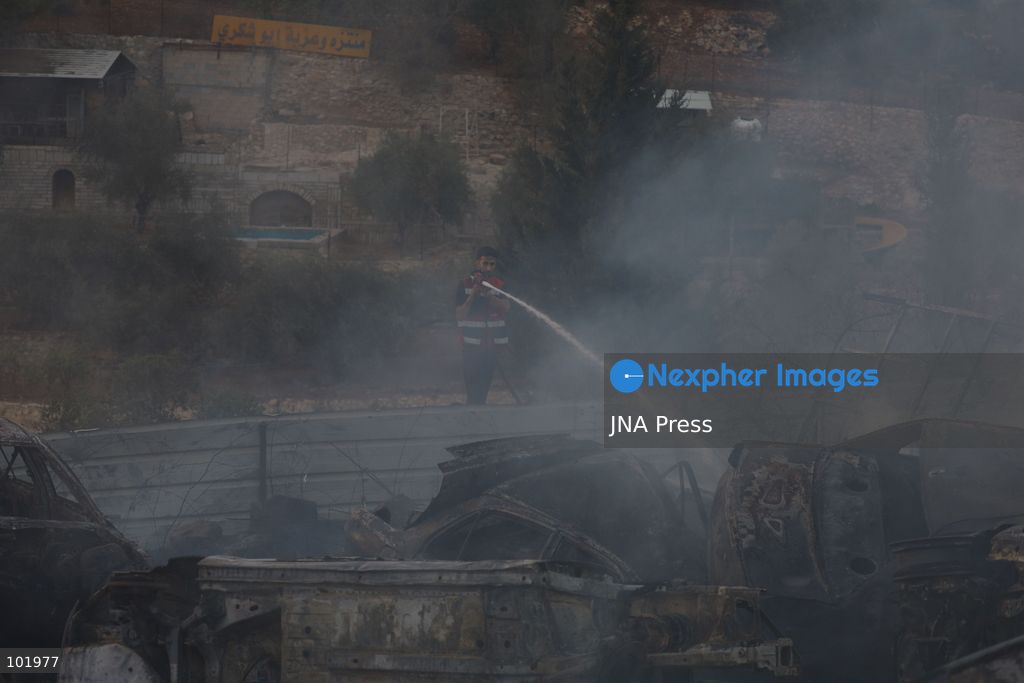 SILWAD, WEST BANK, PALESTINE – OCTOBER 4, 2026: Israeli settlers set fire to olive trees and a car scrap yard between the villages of Ein Yabrud and Silwad, according to the information provided. The owner of the repair shop said more than 50 cars were destroyed in the fire. The incident occurred amid ongoing attacks targeting Palestinian property and agricultural land in the area. Fires affecting olive trees and other Palestinian property have also been reported in areas around Silwad. Photo by Salman Mohsen Alkhatib / JNA Press (Photo by Salman Mohsen Alkhatib/JNA Press via Nexpher Images)