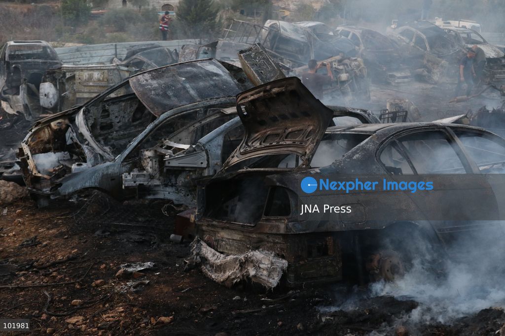 SILWAD, WEST BANK, PALESTINE – OCTOBER 4, 2026: Israeli settlers set fire to olive trees and a car scrap yard between the villages of Ein Yabrud and Silwad, according to the information provided. The owner of the repair shop said more than 50 cars were destroyed in the fire. The incident occurred amid ongoing attacks targeting Palestinian property and agricultural land in the area. Fires affecting olive trees and other Palestinian property have also been reported in areas around Silwad. Photo by Salman Mohsen Alkhatib / JNA Press (Photo by Salman Mohsen Alkhatib/JNA Press via Nexpher Images)