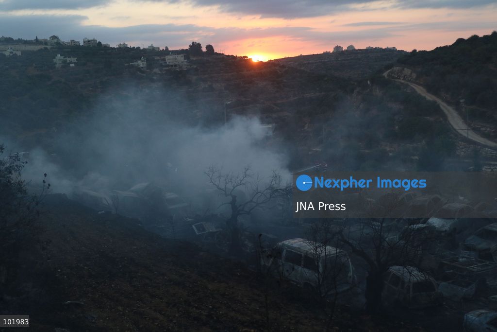 SILWAD, WEST BANK, PALESTINE – OCTOBER 4, 2026: Israeli settlers set fire to olive trees and a car scrap yard between the villages of Ein Yabrud and Silwad, according to the information provided. The owner of the repair shop said more than 50 cars were destroyed in the fire. The incident occurred amid ongoing attacks targeting Palestinian property and agricultural land in the area. Fires affecting olive trees and other Palestinian property have also been reported in areas around Silwad. Photo by Salman Mohsen Alkhatib / JNA Press (Photo by Salman Mohsen Alkhatib/JNA Press via Nexpher Images)