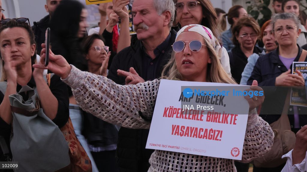 IZMIR, TURKEY – OCTOBER 4, 2026: Animal rights activists staged a protest in Izmir on World Animal Protection Day, opposing the decision to round up and euthanize stray animals. Members of the Izmir Right to Life Advocates gathered in front of Alsancak Train Station in the Konak district and protested against the Law Amending the Animal Protection Act, which was passed by the Grand National Assembly of Turkey on July 30, 2024, published in the Official Gazette on August 2, 2024, and entered into force. Activists marched from Alsancak Station along Cyprus Martyrs Street before gathering in front of the Türkan Saylan Cultural Center. Chanting slogans including “No to your laws, let the animals live” and “Government, resign,” the protesters formed a human chain to draw attention to animal rights. Photo by Turgay Kilic / JNA Press. (Photo by Turgay Kilic/JNA Press via Nexpher Images)