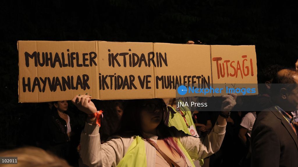 IZMIR, TURKEY – OCTOBER 4, 2026: Animal rights activists staged a protest in Izmir on World Animal Protection Day, opposing the decision to round up and euthanize stray animals. Members of the Izmir Right to Life Advocates gathered in front of Alsancak Train Station in the Konak district and protested against the Law Amending the Animal Protection Act, which was passed by the Grand National Assembly of Turkey on July 30, 2024, published in the Official Gazette on August 2, 2024, and entered into force. Activists marched from Alsancak Station along Cyprus Martyrs Street before gathering in front of the Türkan Saylan Cultural Center. Chanting slogans including “No to your laws, let the animals live” and “Government, resign,” the protesters formed a human chain to draw attention to animal rights. Photo by Turgay Kilic / JNA Press. (Photo by Turgay Kilic/JNA Press via Nexpher Images)